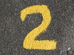 number, advertisement, yellow, colour, asphalt, road, digit, numbering, two, number, number, number, number, number
